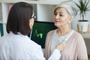 Doctor checking heart health of a midlife woman, representing cardiovascular risk during menopause.