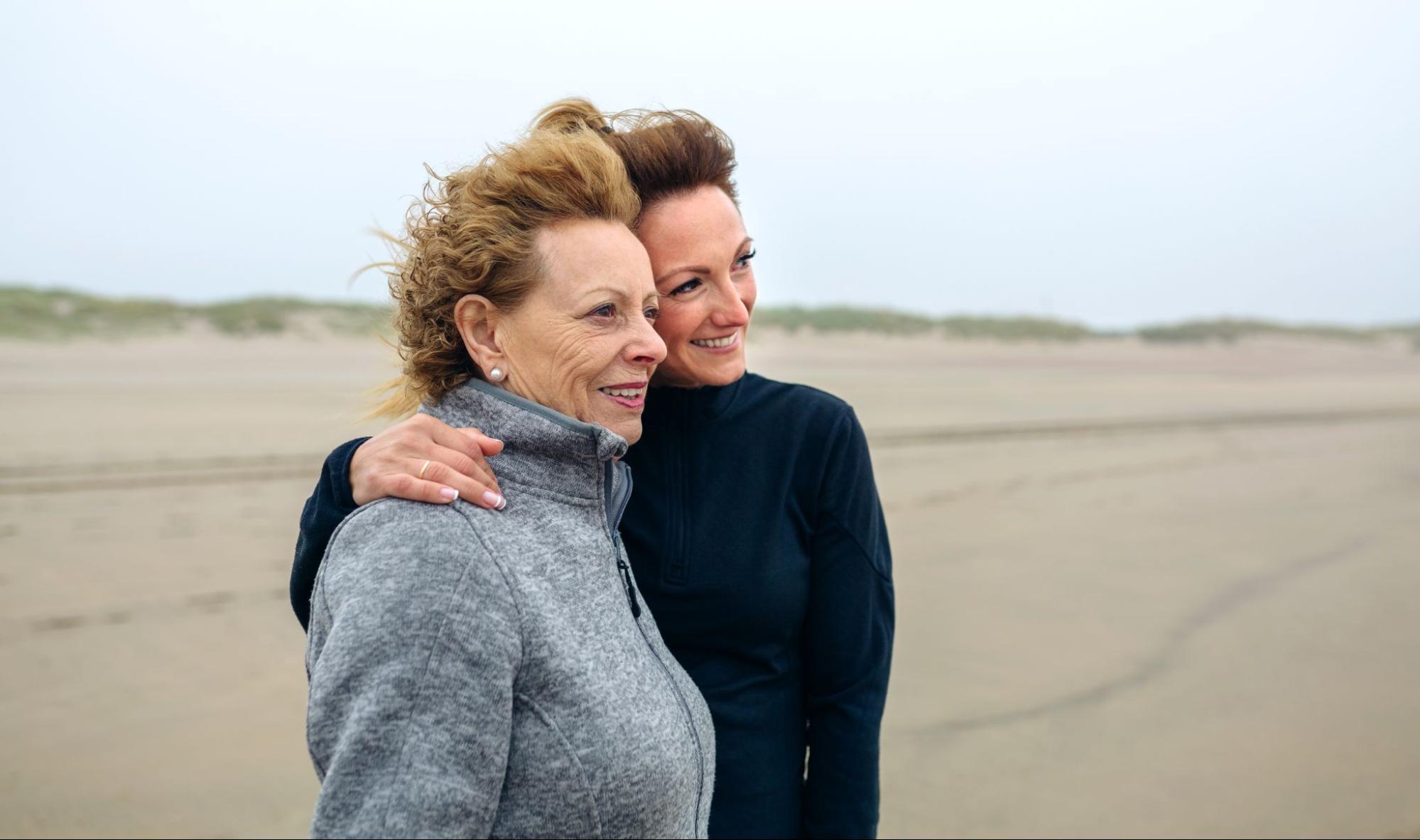 Midlife women supporting each other outdoors, representing PCOS and hormonal health after 40.