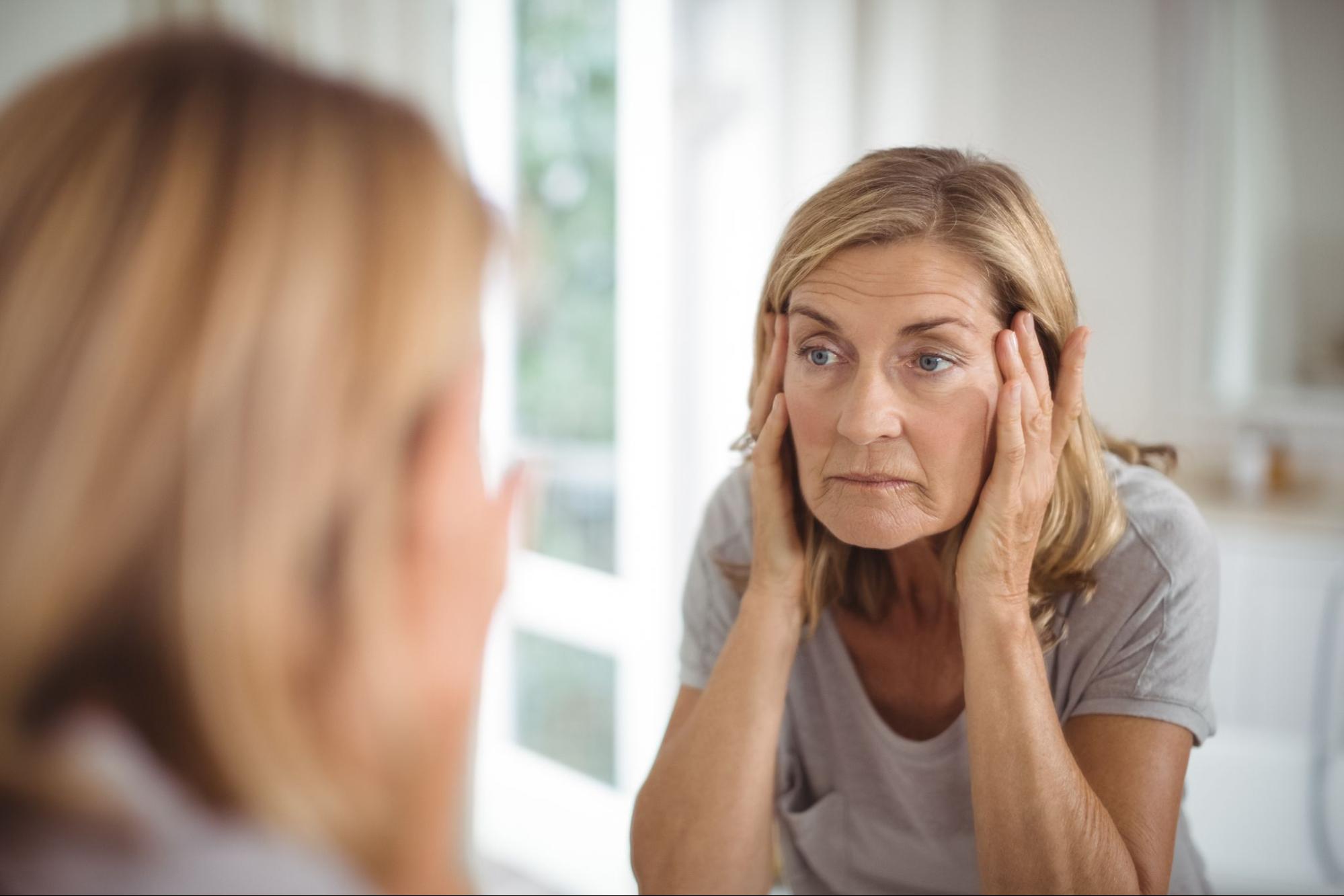 Woman experiencing difficulty with focus and memory during menopause, reflecting ADHD-related challenges after 40.